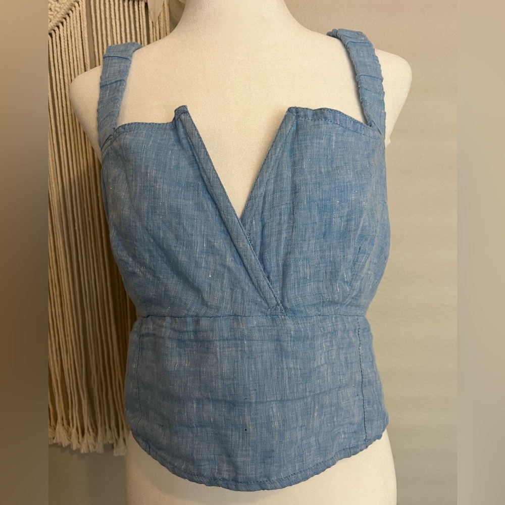 Charming cross-back styling make this tank a go-to choice for sunny days.